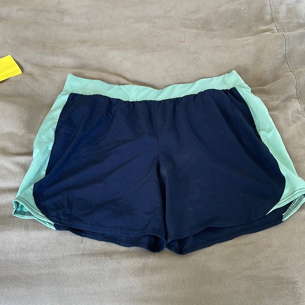 Navy and teal women's athletic shorts.